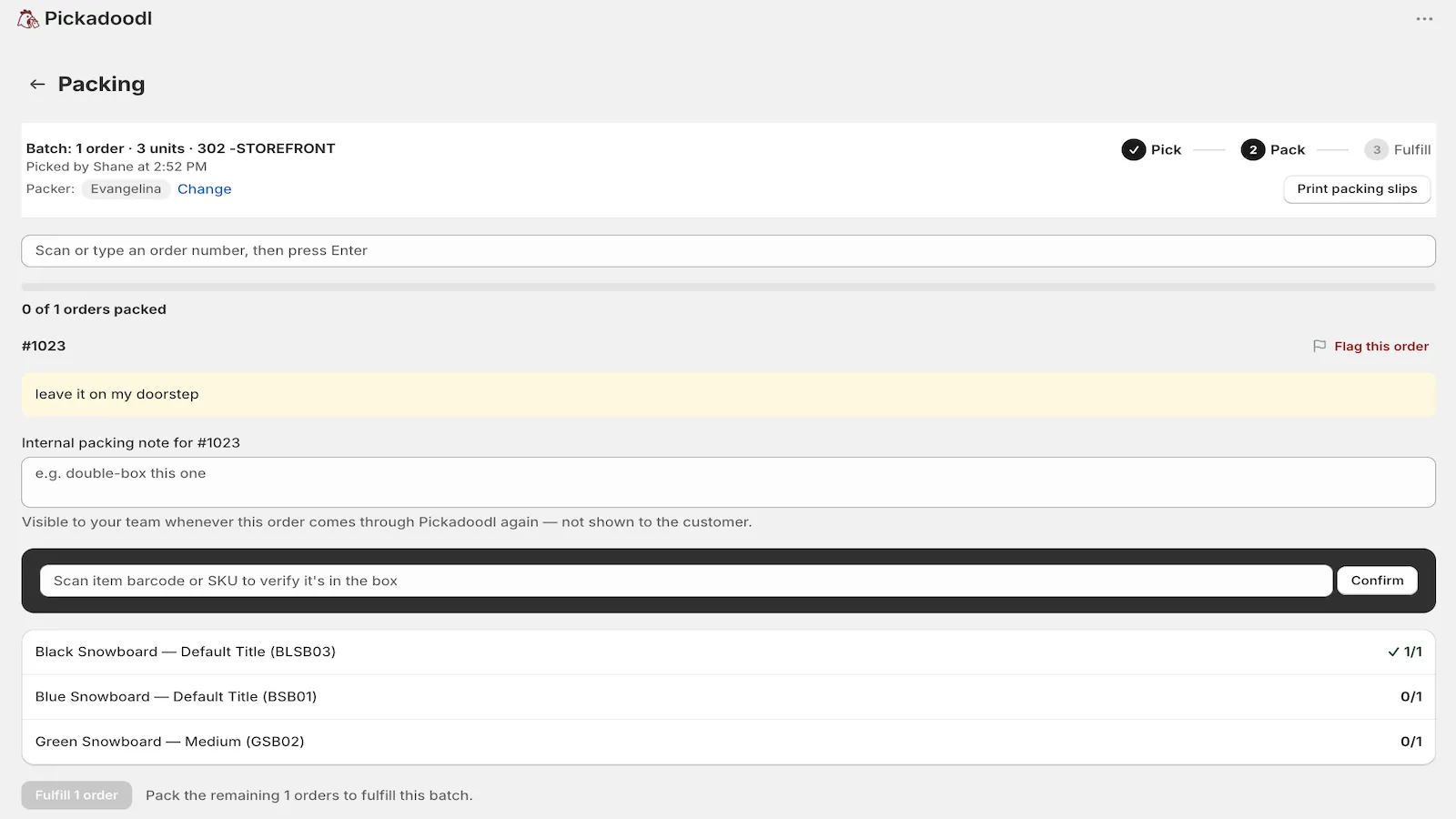 Pickadoodl packing screen: scan an item barcode or SKU to verify it is in the box, with a delivery note and per-item progress